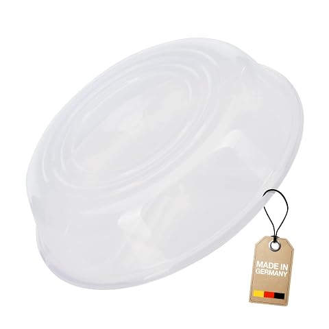 Couvercle rond transparent pour micro-ondes posé sur une assiette dans une cuisine claire