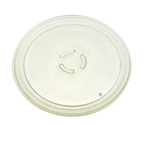 Plaque tournante ronde en verre jaune de 28 cm posée sur un plan de travail de cuisine.