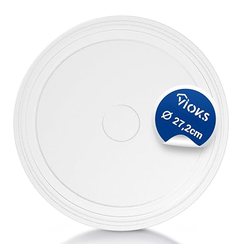 Plateau tournant de rechange en verre transparent de 27,2 cm posé sur un plan de cuisine.