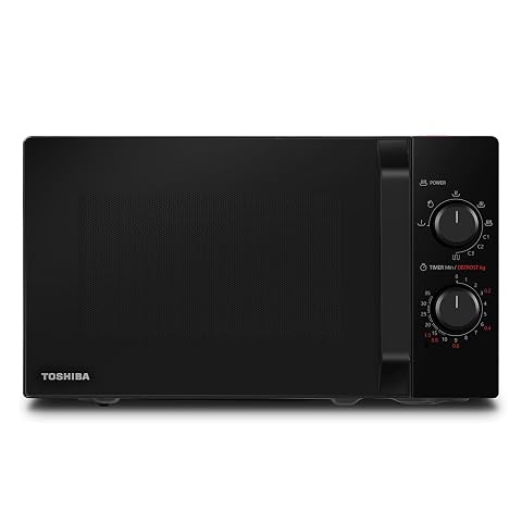 Four micro-ondes combiné noir avec plateau tournant et grille, posé sur un plan de travail en bois clair.