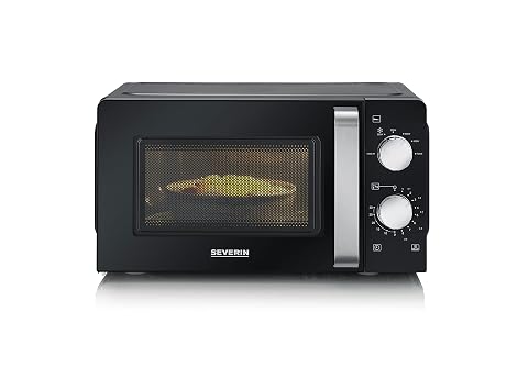 Micro-ondes solo noir compact avec commandes rotatives et plateau tournant sur un plan de travail