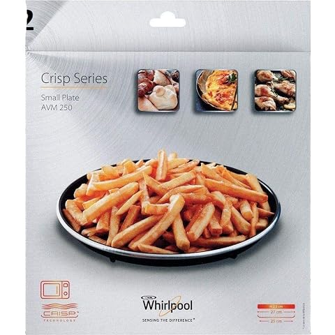 Plat Crisp Whirlpool rond à rebord bas, teinte inox, posé sur un plan de travail en bois clair.