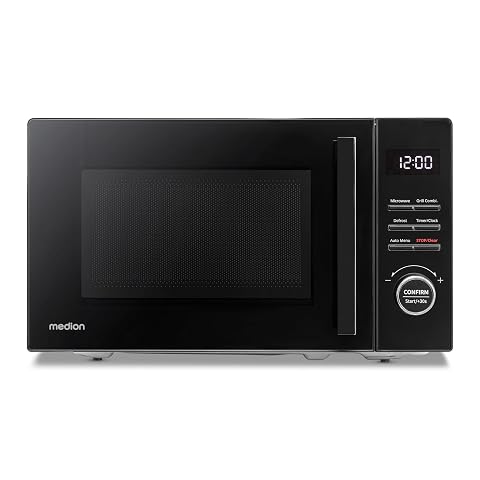 Micro-ondes grill Medion noir avec plateau tournant en verre et grille, posé sur un plan de travail