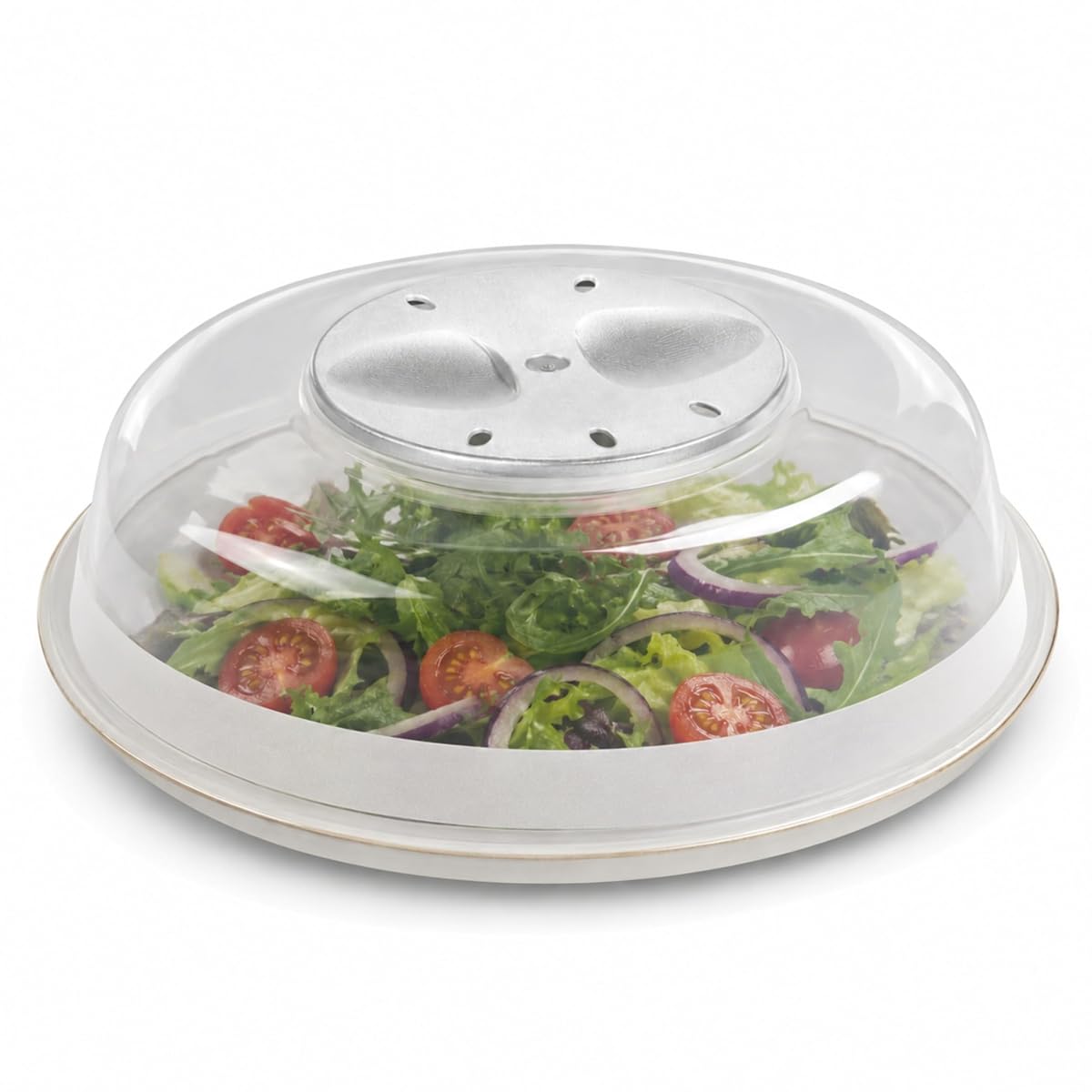 Cloche alimentaire transparente de 24 cm posée sur une assiette dans une cuisine claire.