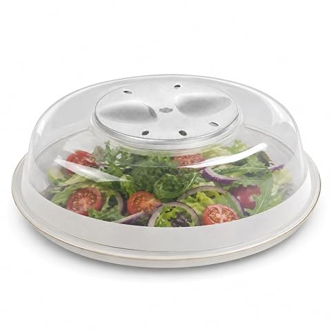 Cloche alimentaire transparente de 24 cm posée sur une assiette dans une cuisine claire.