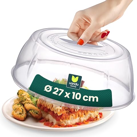 Cloche micro-ondes transparente de 27 cm posée sur une assiette pour limiter les éclaboussures.